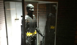 Illustration for article titled A Celebration of Superheroes Staring at Costumes in Fancy Display Cases